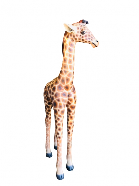 Tall giraffe sculpture with spots