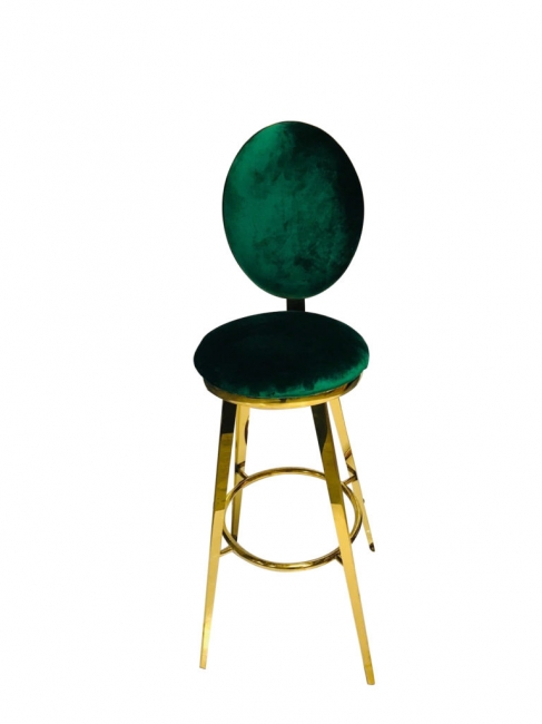 Modern chair with green seat and gold frame.