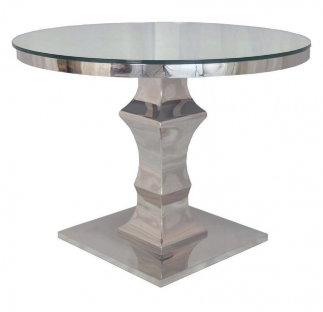 Sleek dining table featuring glass and metal.