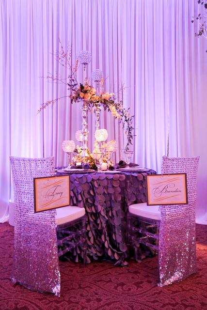 Romantic dinner setup with purple decor