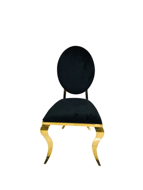 Black velvet chair and golden accents