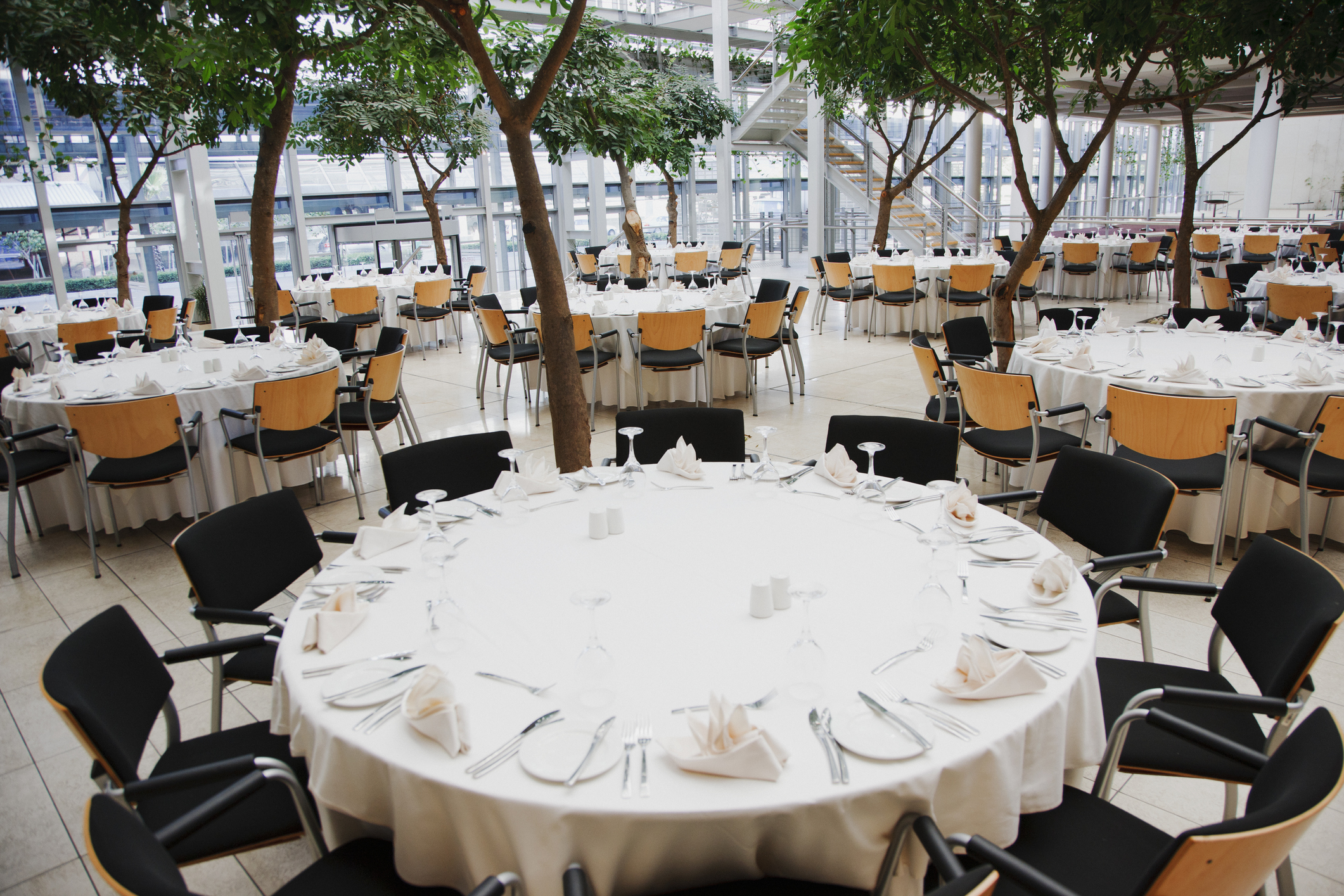 Elegant banquet hall with round tables
