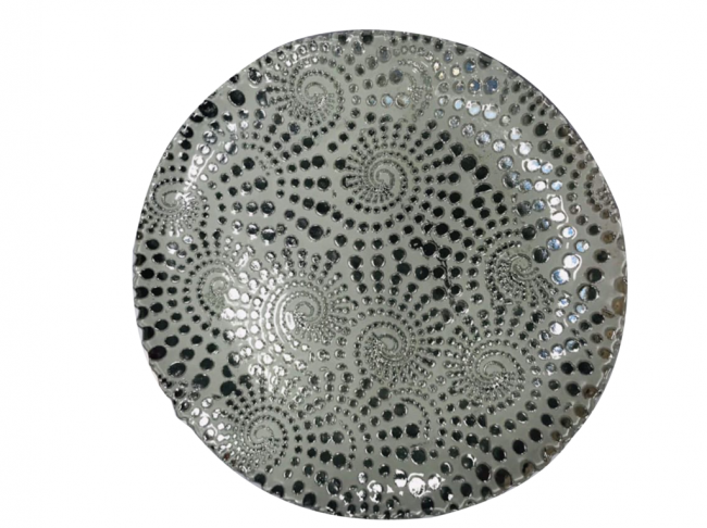 Textured ceramic plate with black dots