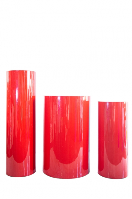 Red cylindrical pedestals on white background