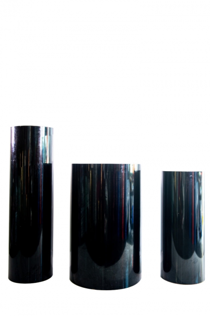 Black cylindrical pedestals on white background