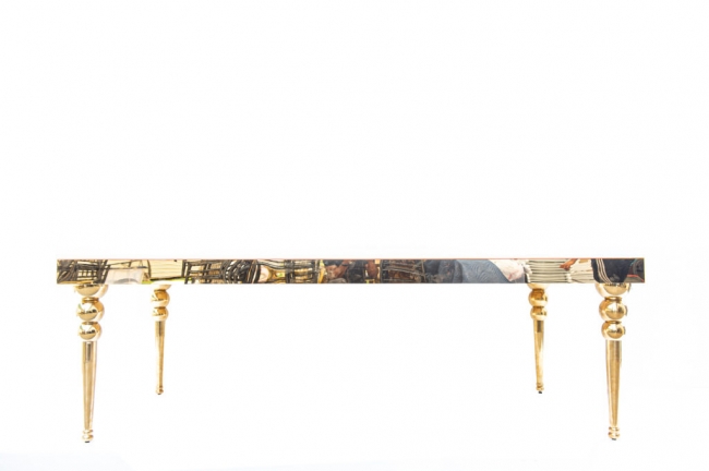 Decorative golden table with ornate legs