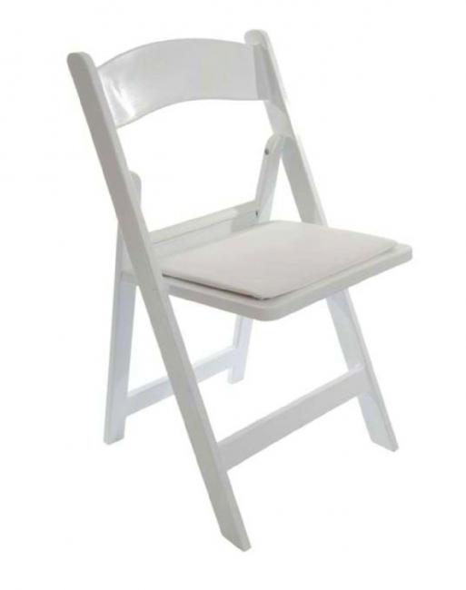 White folding chair with cushioned seat.