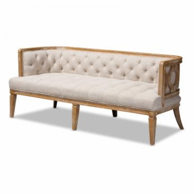Elegant tufted beige sofa with wooden frame
