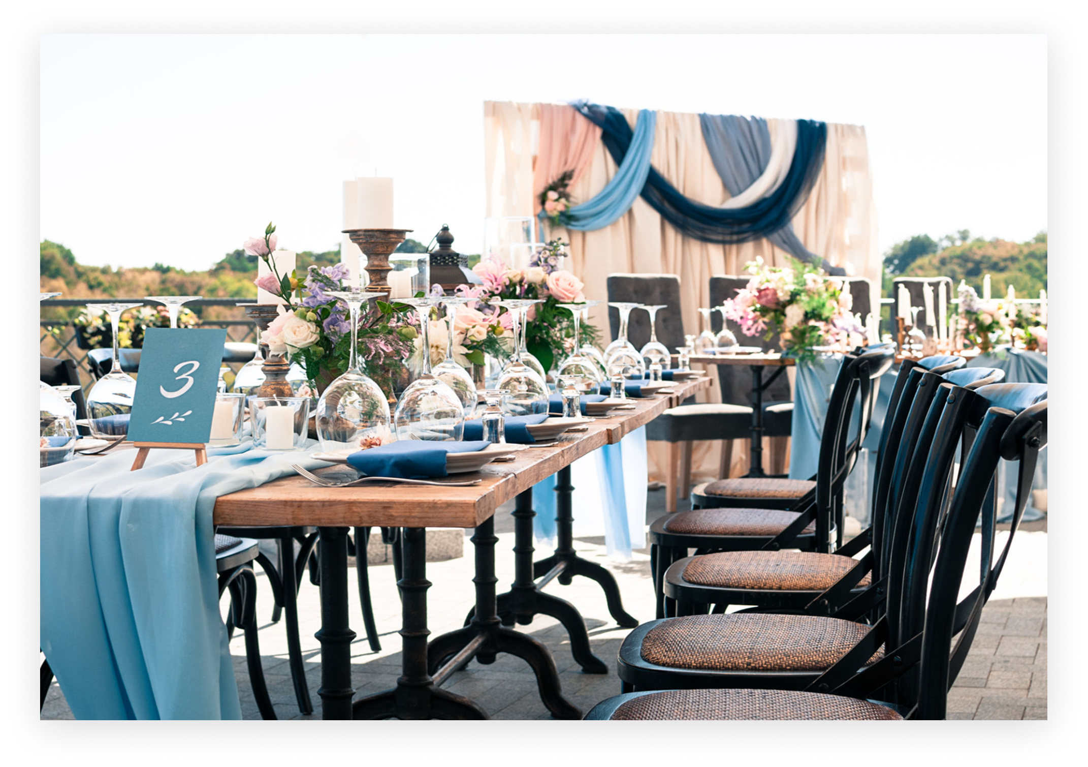 Stylish banquet table in natural setting.