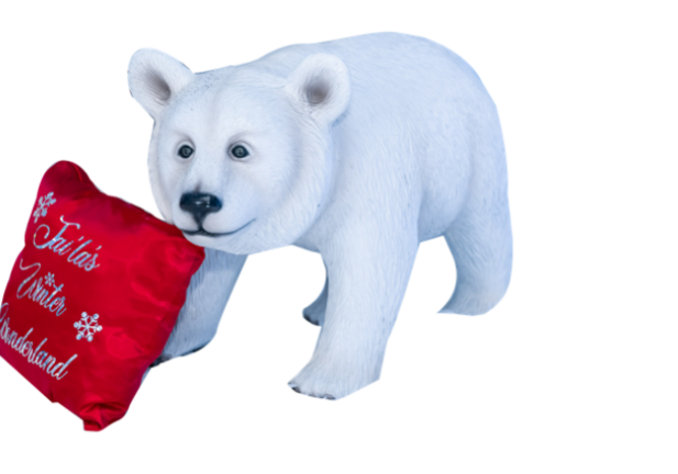 Toy bear with Christmas-themed pillow