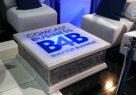 Comcast Business promotional setup with chairs