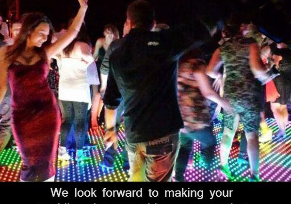 People dancing at a colorful party