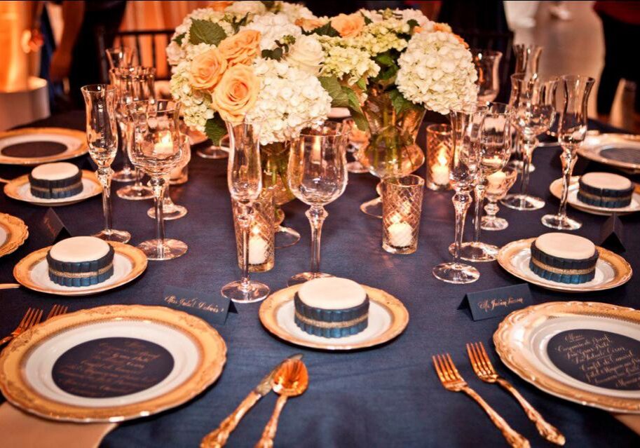 Formal dining arrangement with gold utensils