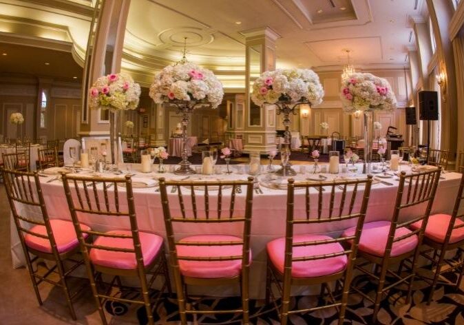 Formal dining setup with pink accents