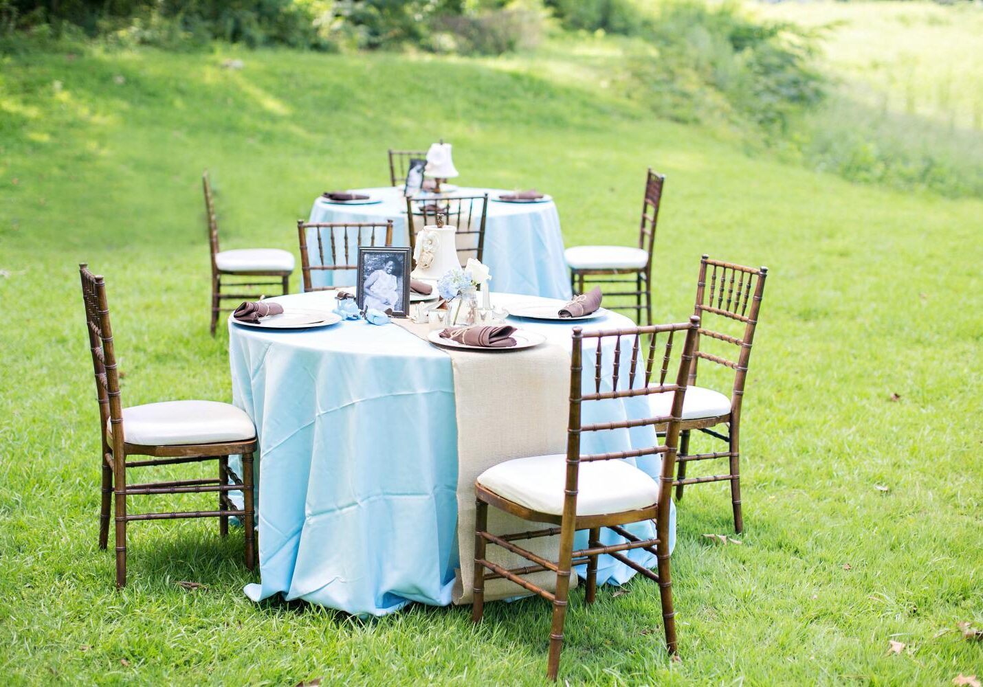 Outdoor table setup with blue tablecloth