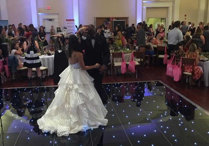 Couple's first dance with guests watching