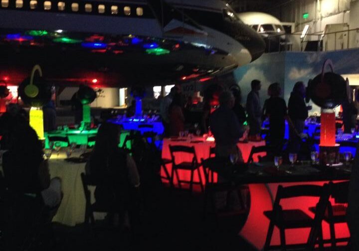 Vibrant party under airplane wing