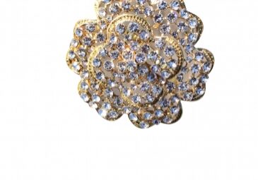 Decorative gold brooch with rhinestones