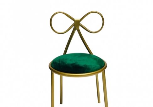Gold chair with green velvet seat