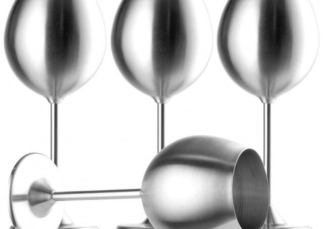 Four metallic wine goblets displayed