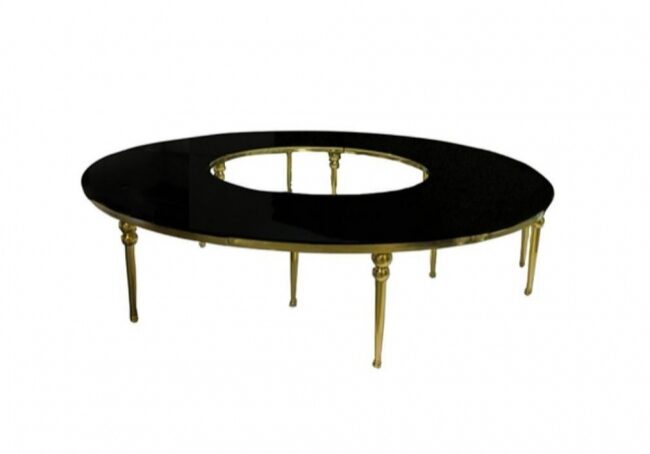 Black oval table with gold legs
