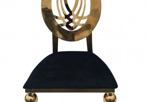 Golden chair with black cushion