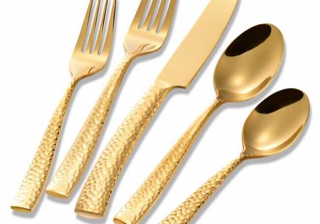 Luxurious gold flatware on white background