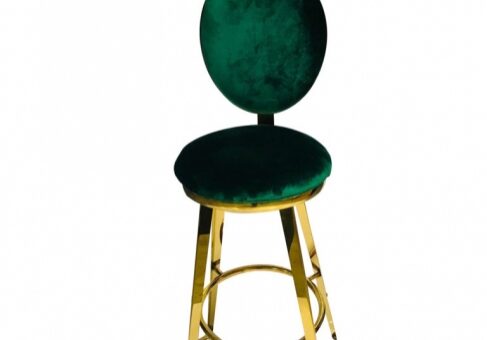 Modern chair with green seat and gold frame.