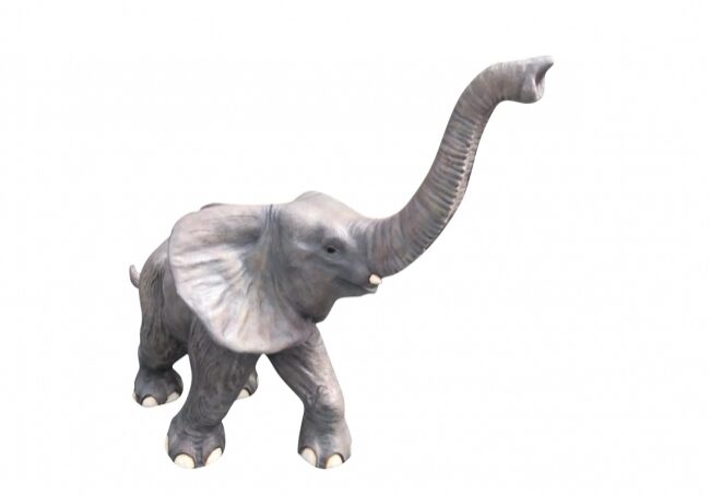 Elephant sculpture isolated on white backdrop.