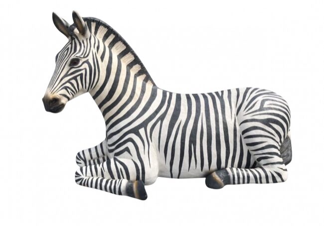 Striped zebra sculpture on display.