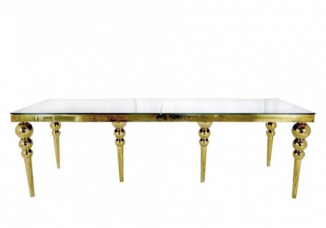 Elegant gold table with glass top