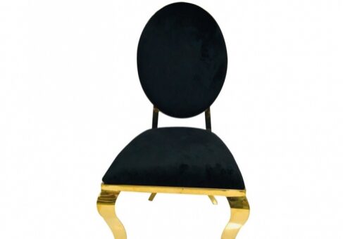Black velvet chair and golden accents