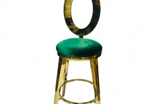 Elegant stool with green cushion and gold frame.