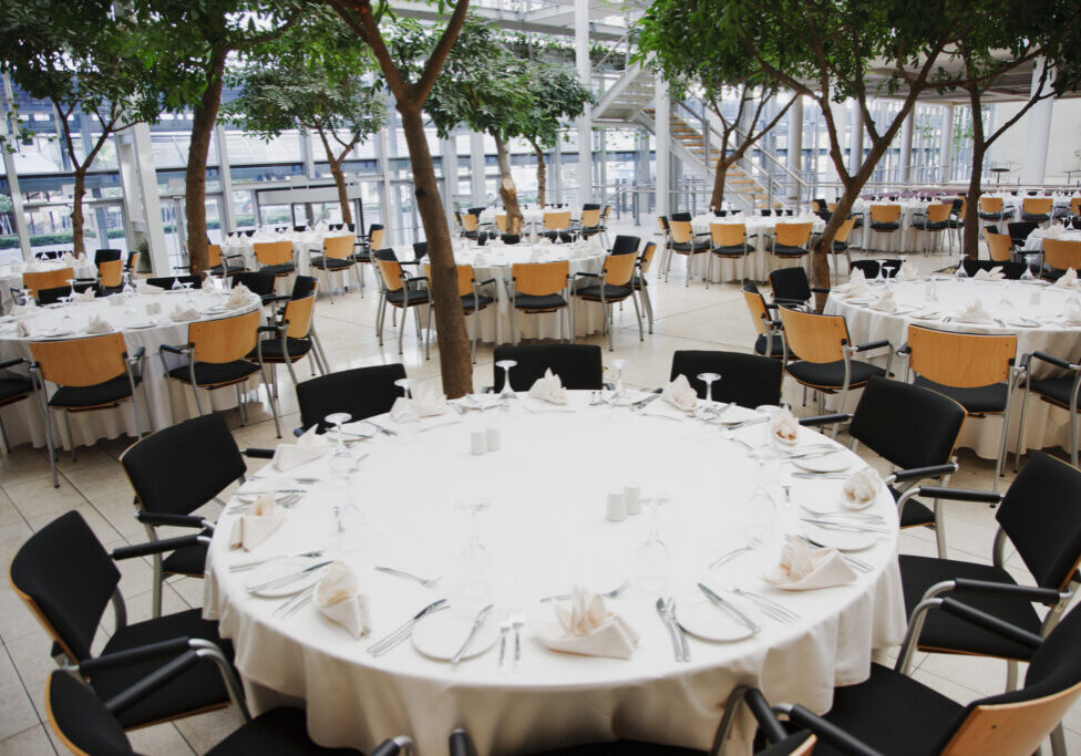 Elegant banquet hall with round tables