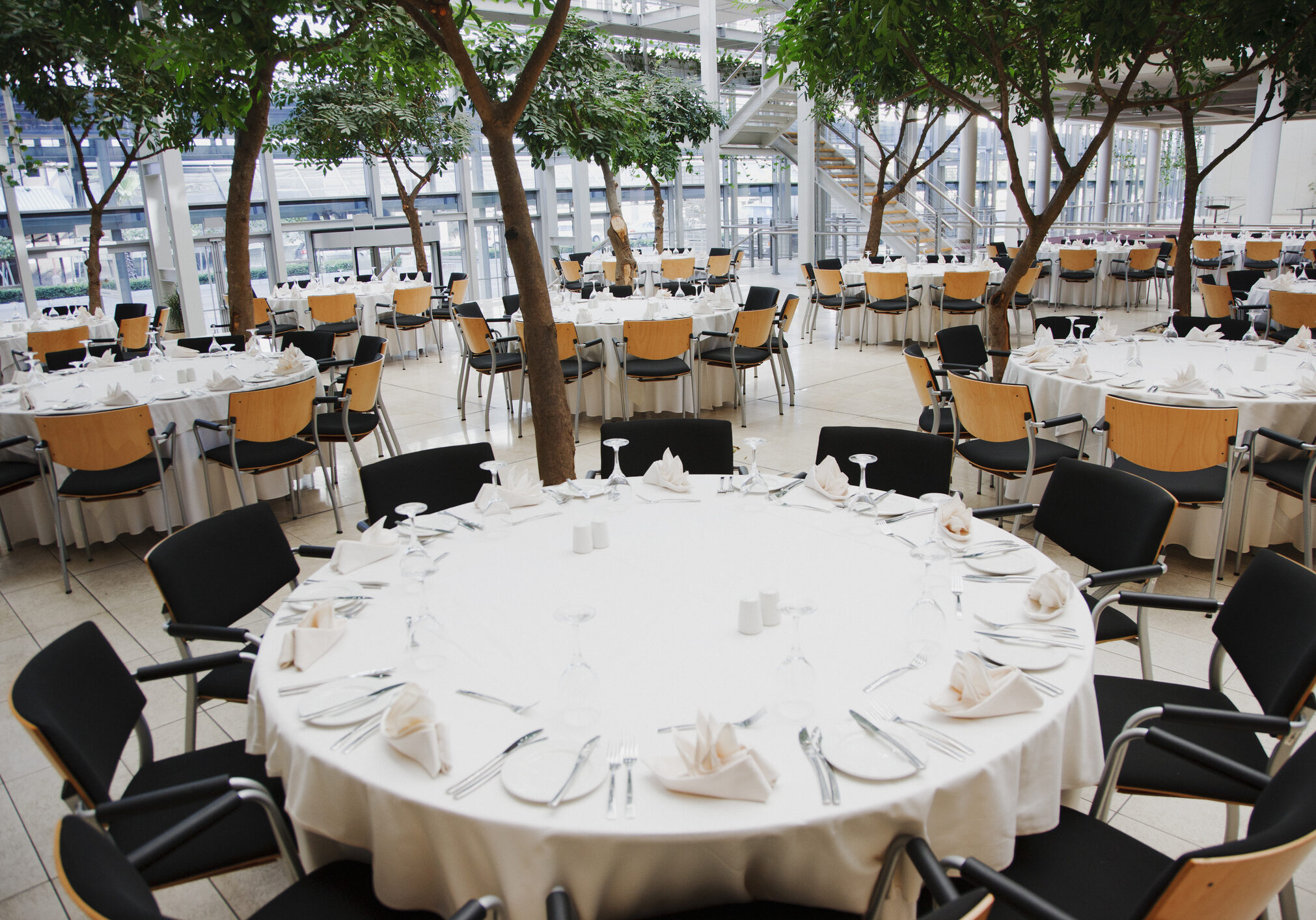 Elegant banquet hall with round tables