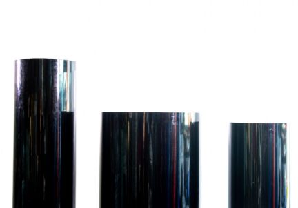 Black cylindrical pedestals on white background