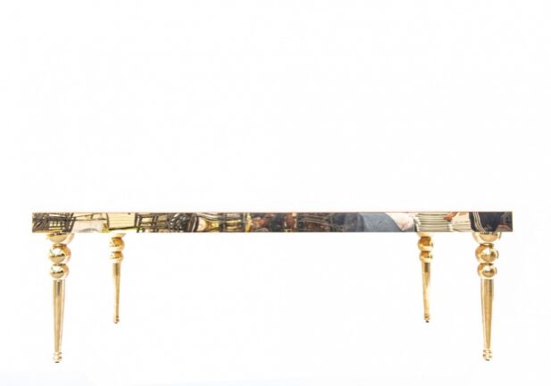 Decorative golden table with ornate legs