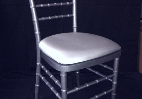 Silver chair with cushioned seat