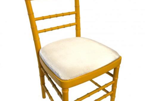 Yellow wooden chair with cushioned seat