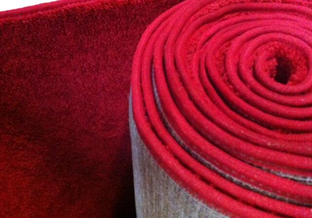 Rolled red carpet close-up